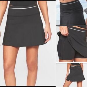 Athleta Ace Black Tennis Skort with silver reflective stripe on waistband